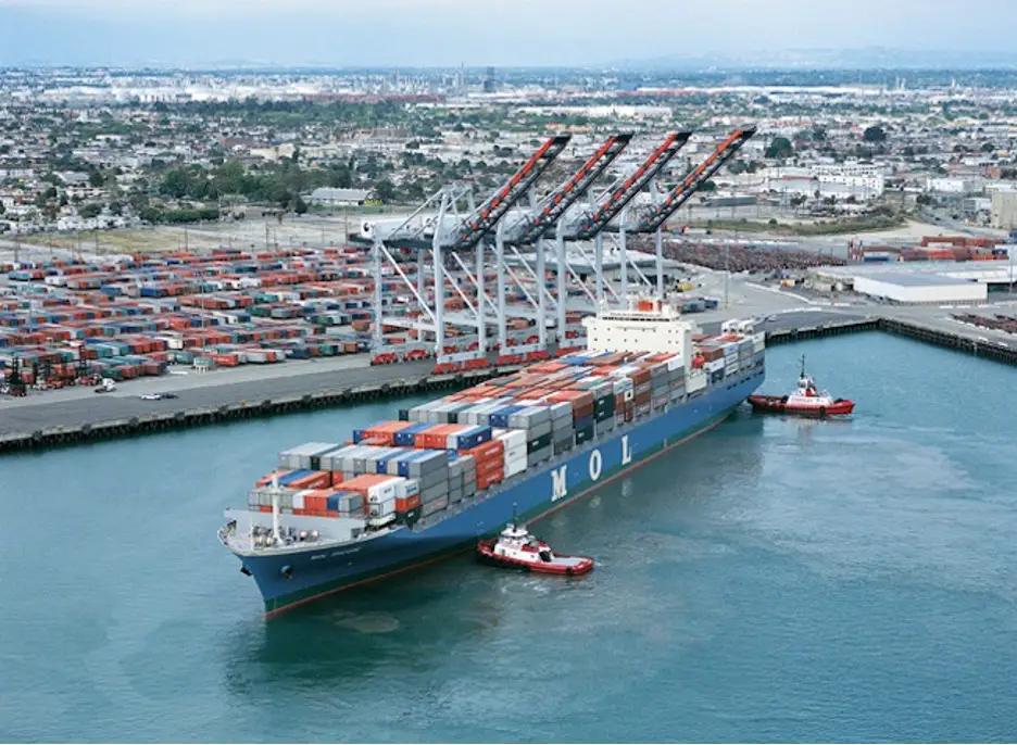 Container ship berthing with aid of tugs